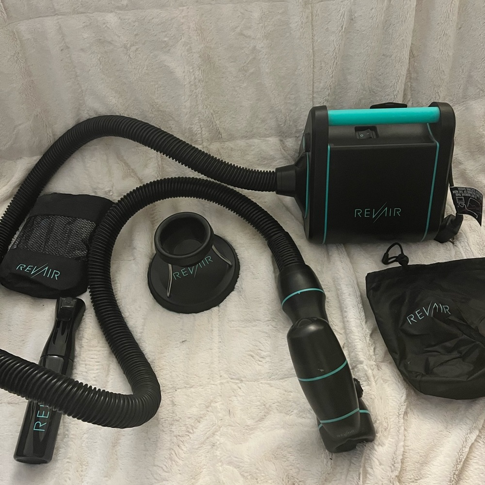 RevAir reverse blow dryer with various accessories and storage case